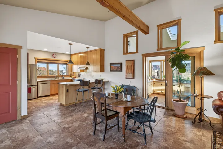 Dining space featuring a high ceiling