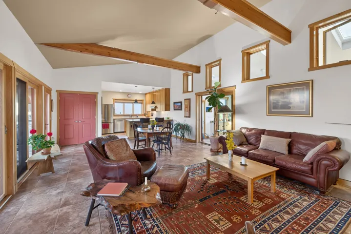 Living room featuring lofted ceiling