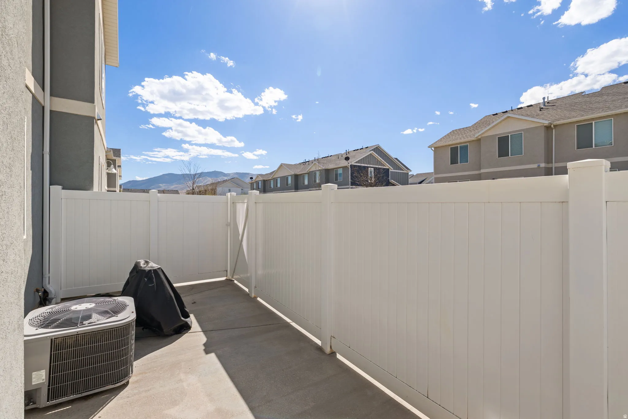 View of patio / terrace featuring a residential view and a mountain view