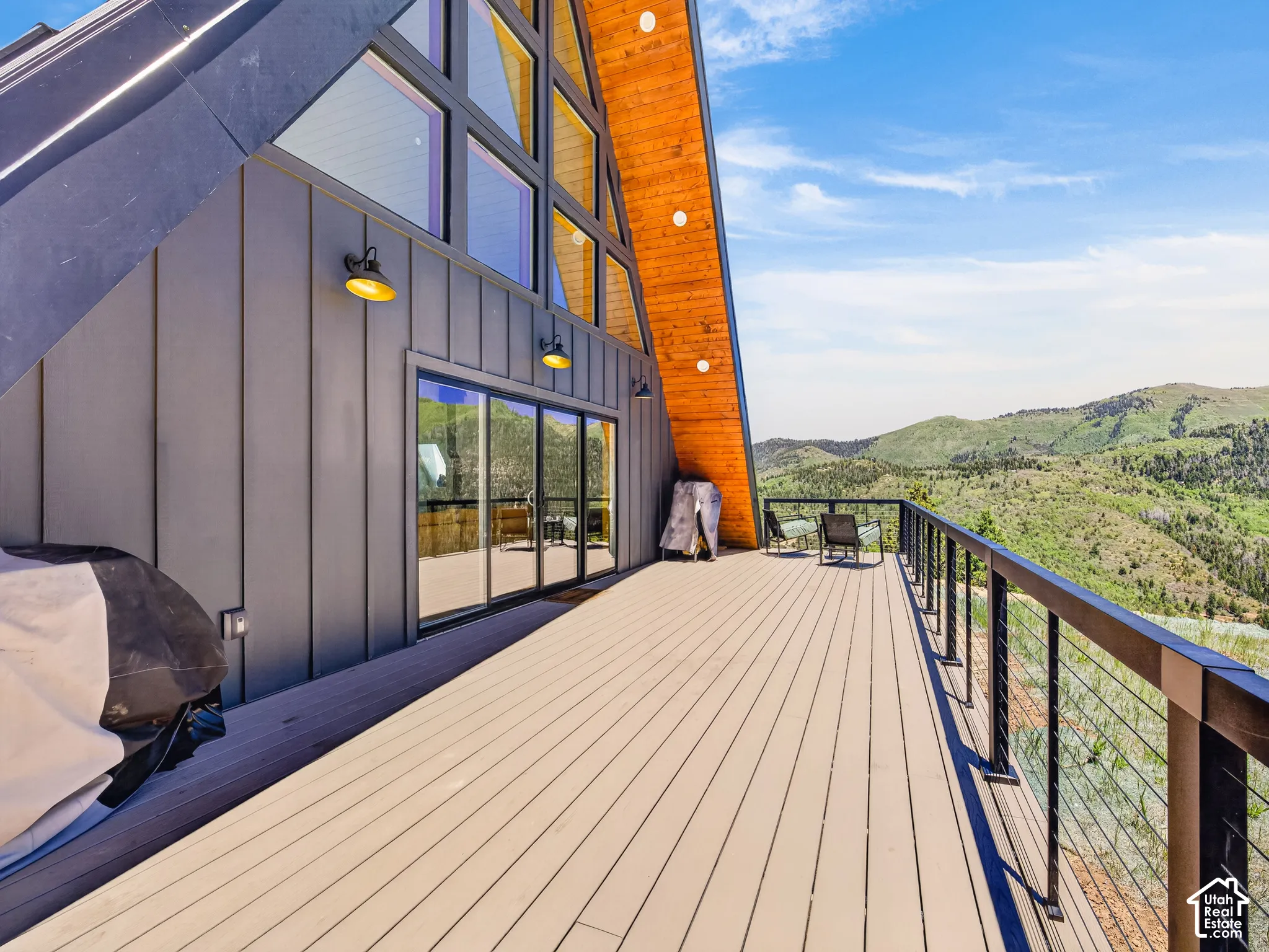Expansive outdoor deck with mountain scenery