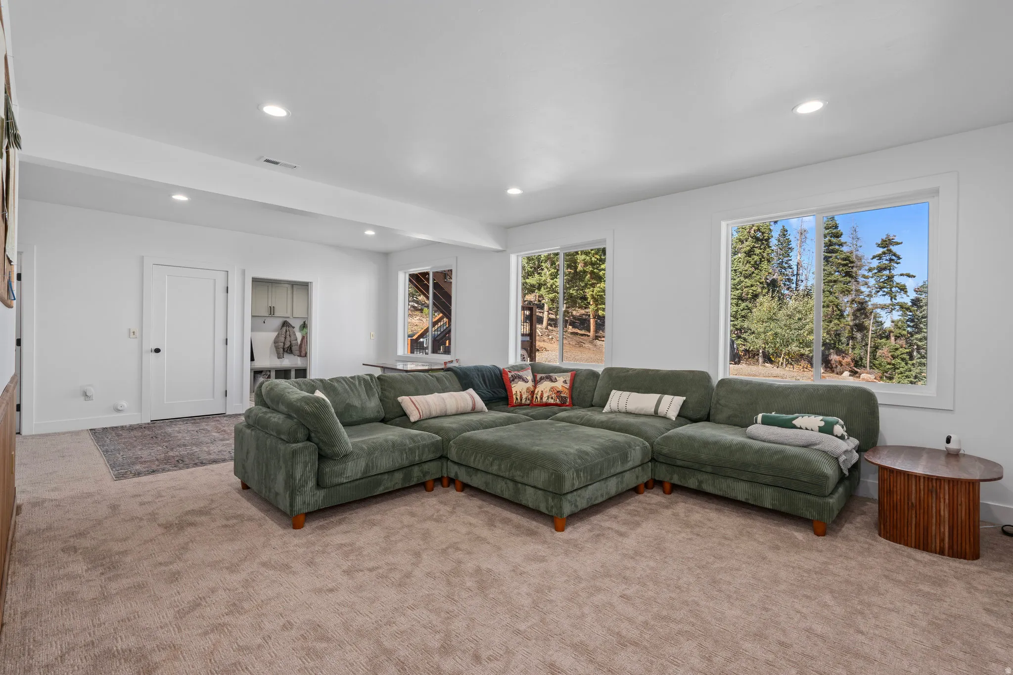 Living area featuring carpet and recessed lighting
