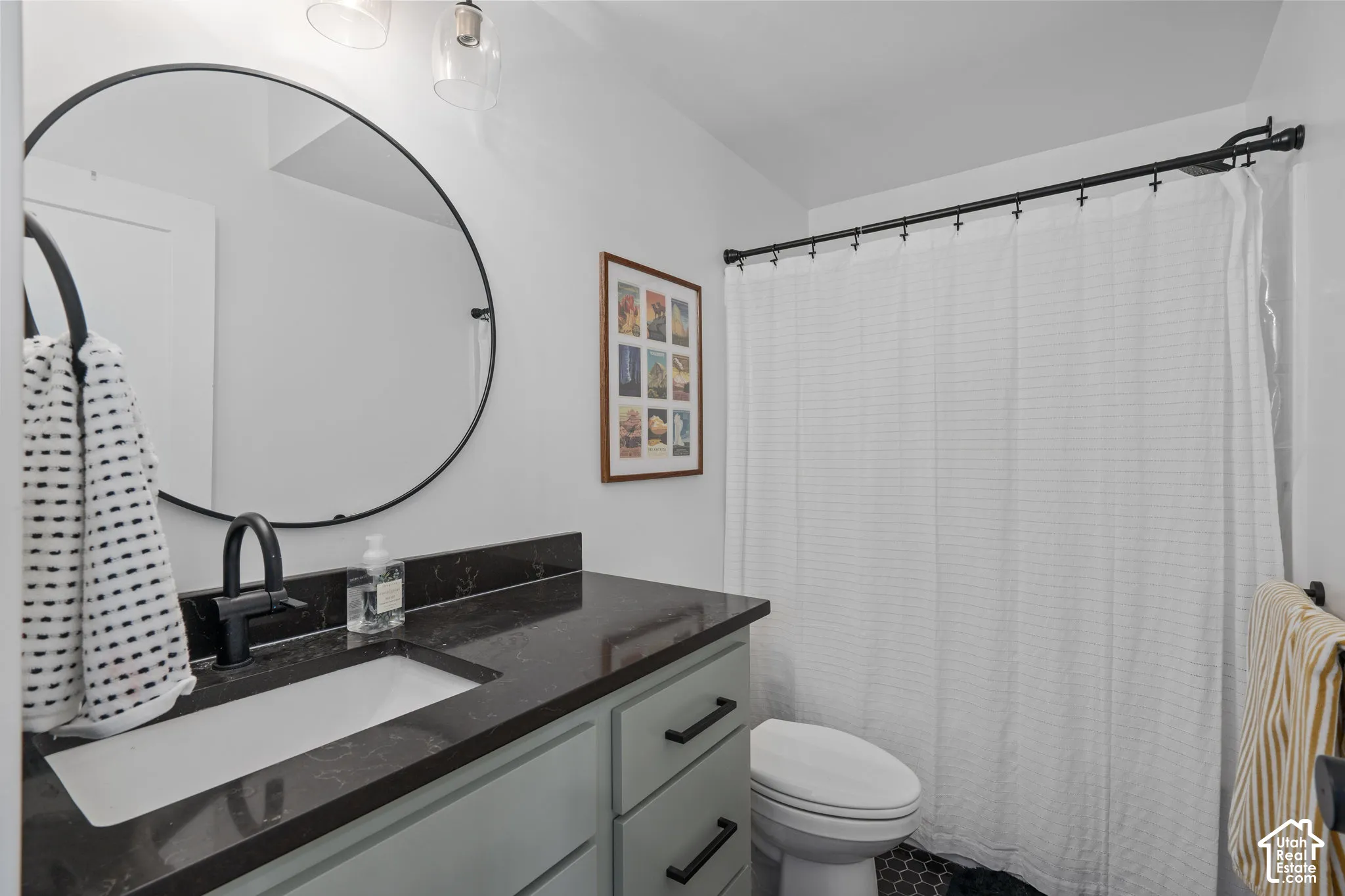 Full bath featuring vanity and toilet