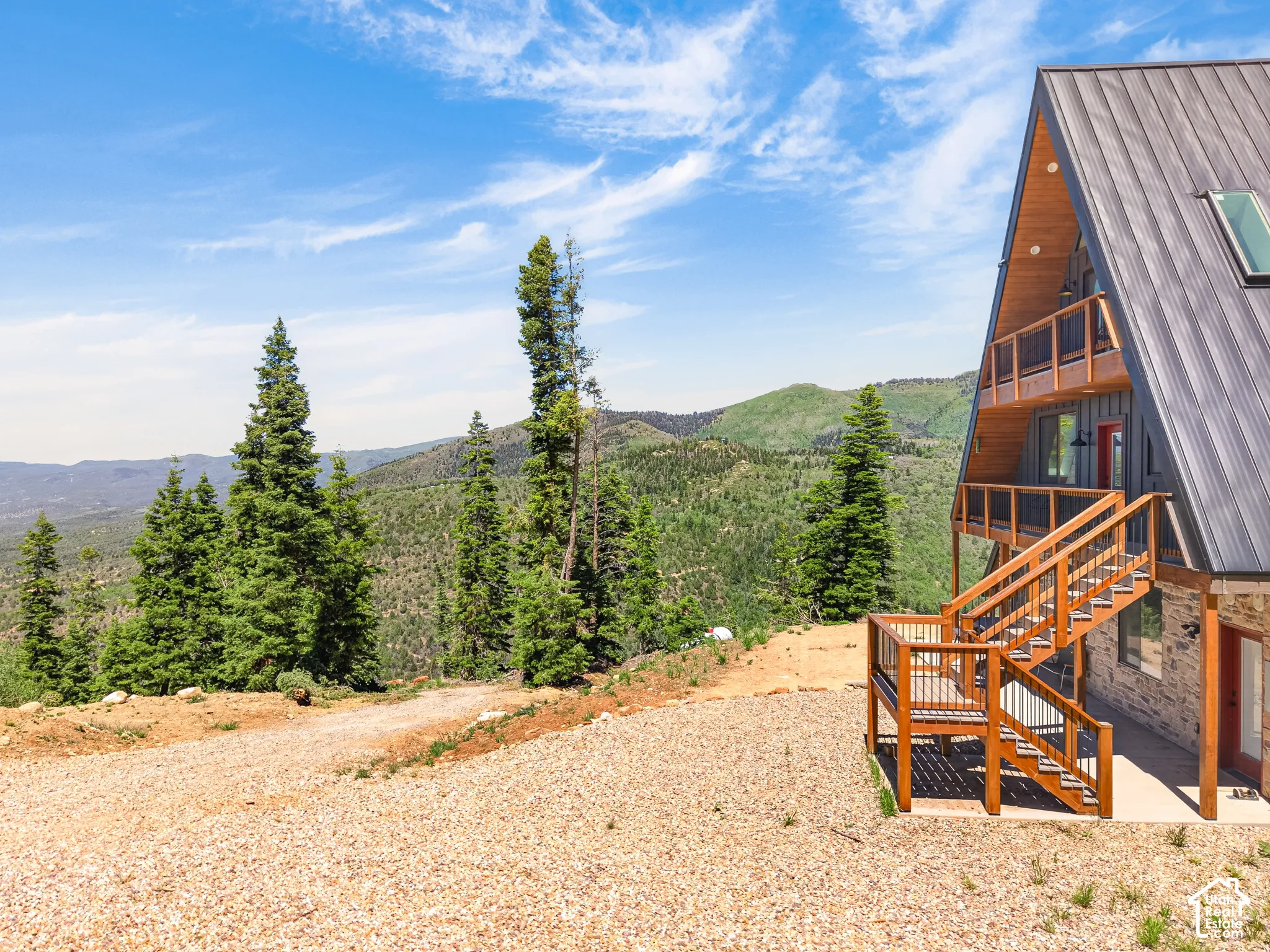 A-frame residence featuring a metal roof and light wood-finish siding