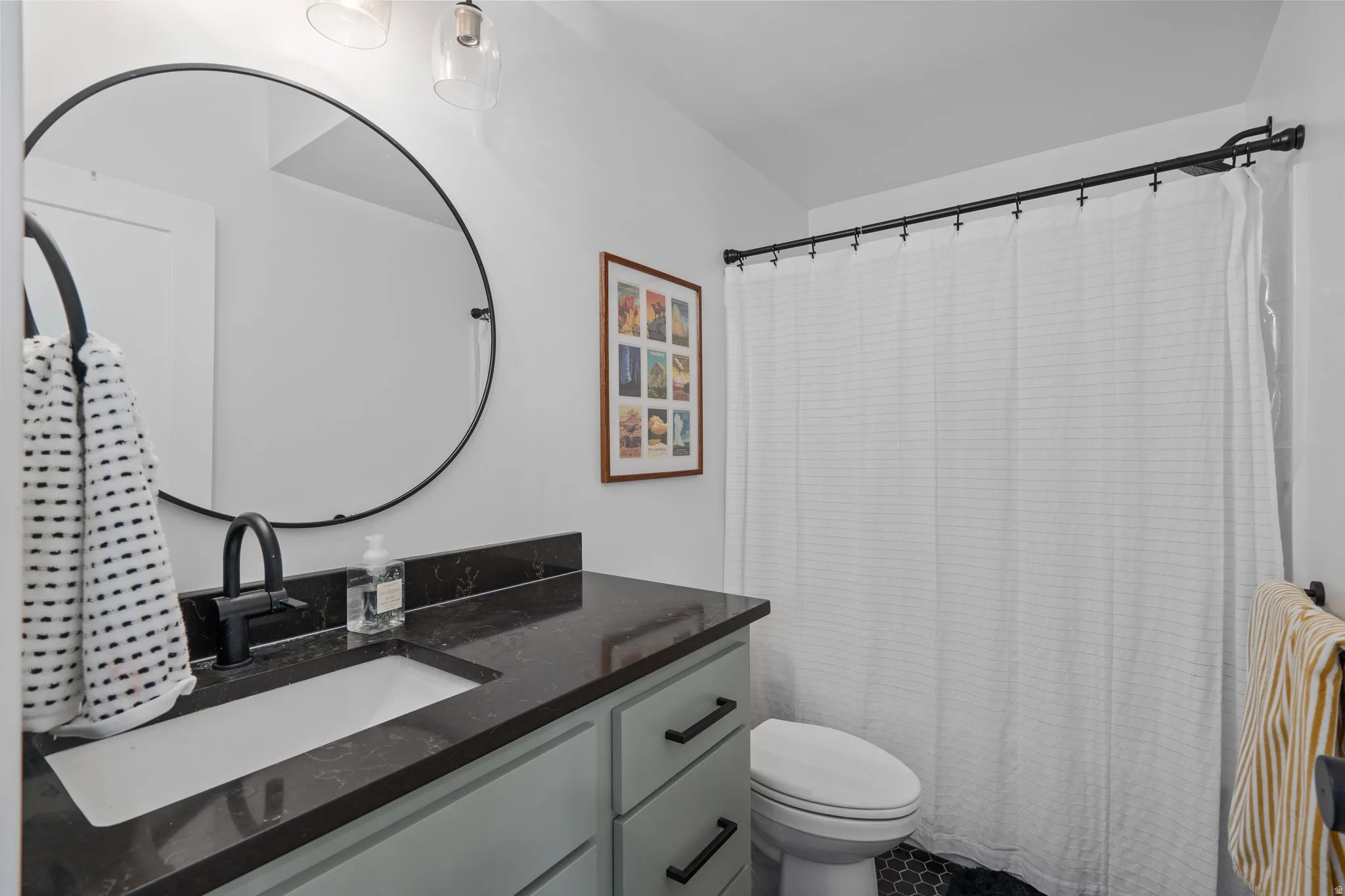 Full bath featuring vanity and toilet