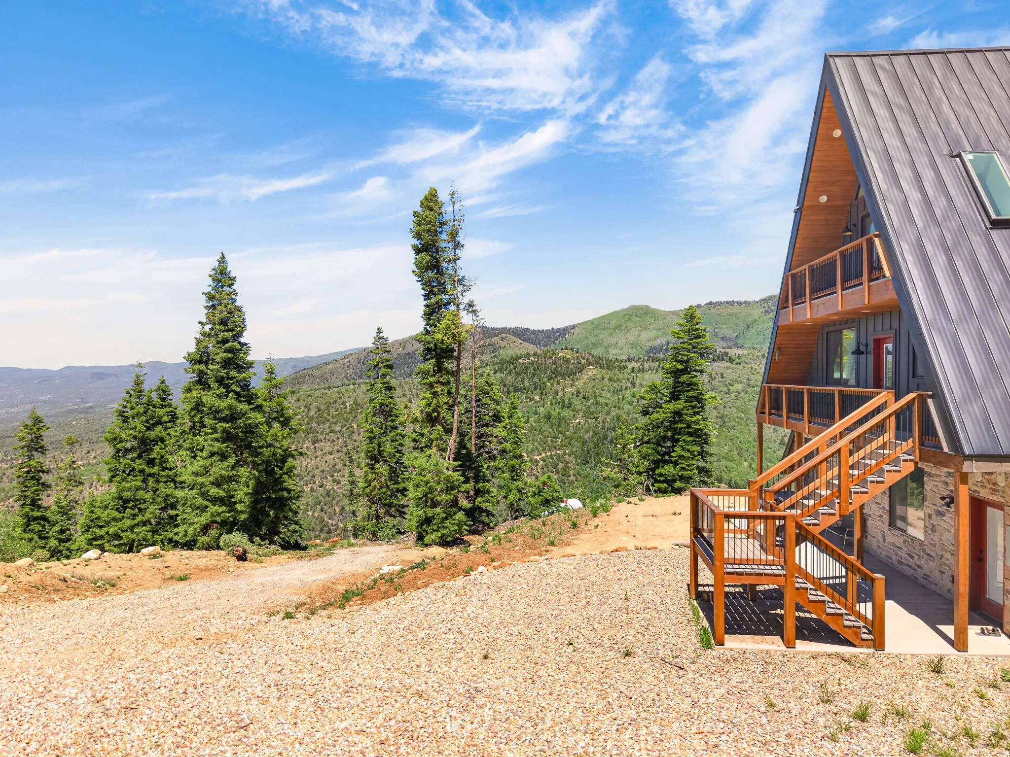 A-frame residence featuring a metal roof and light wood-finish siding