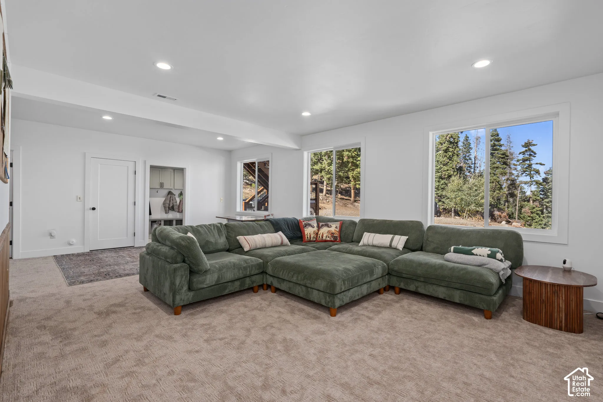 Living area featuring carpet and recessed lighting