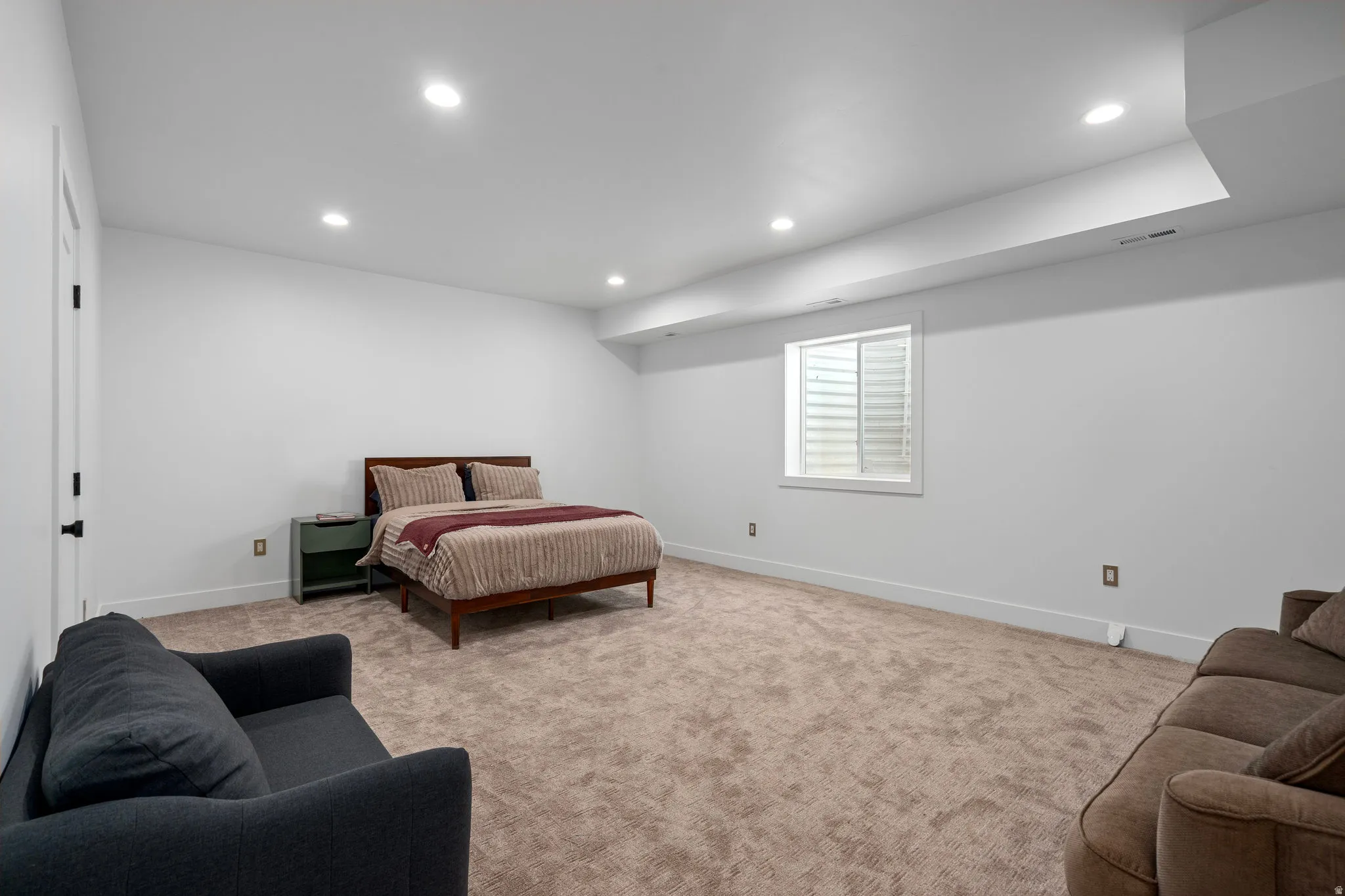 Bedroom featuring recessed lighting and light carpet