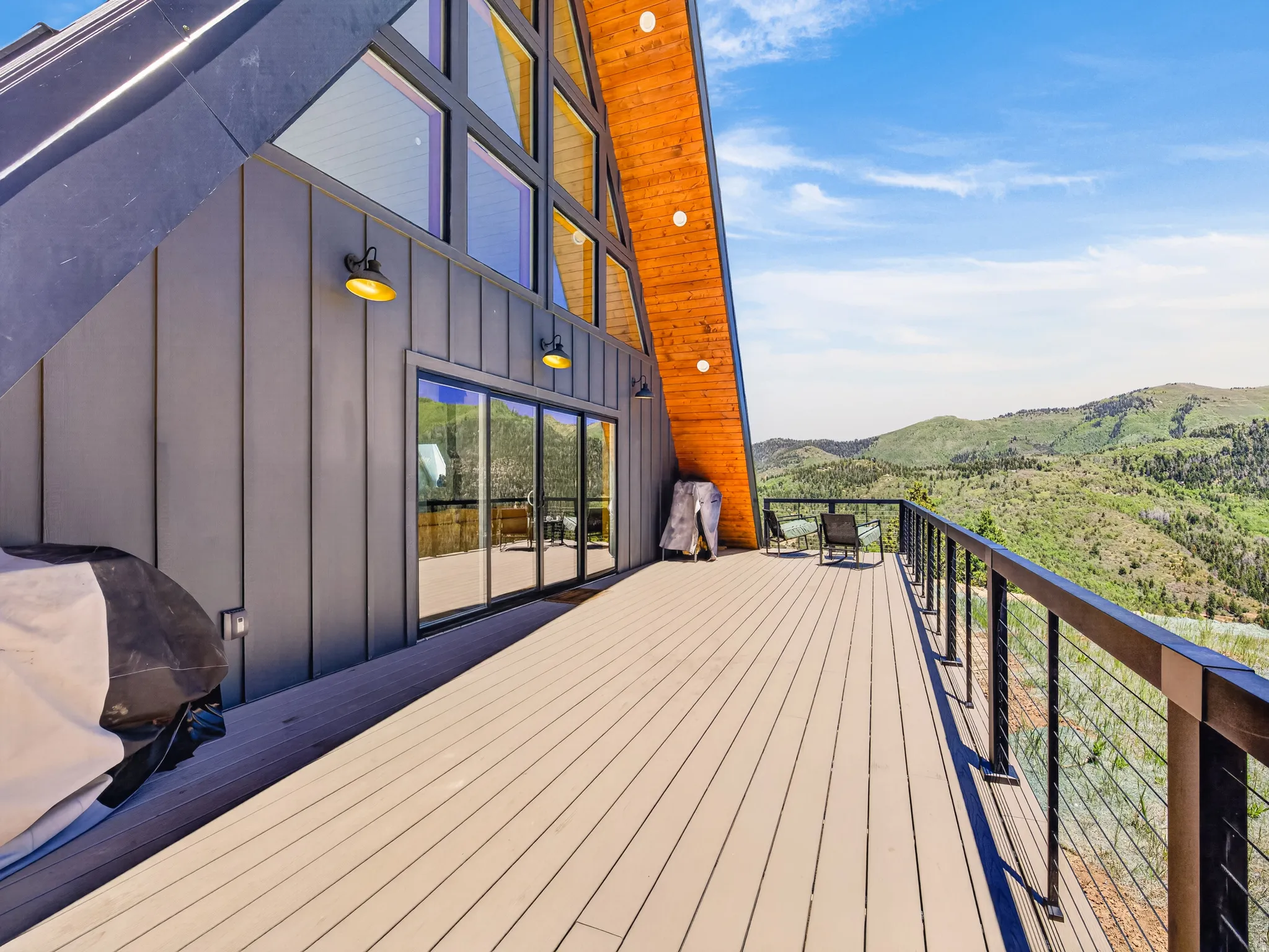 Expansive outdoor deck with mountain scenery