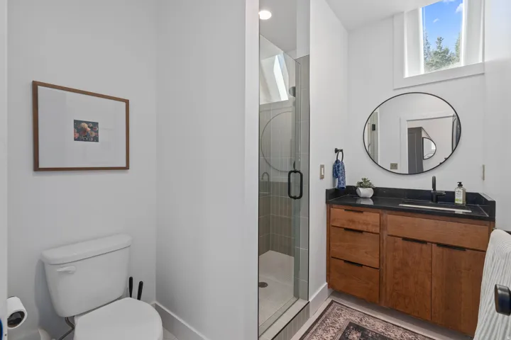 Bathroom with vanity and a stall shower