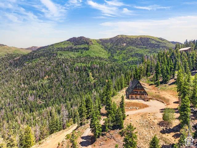 A-frame residence with multiple balconies and a covered porch