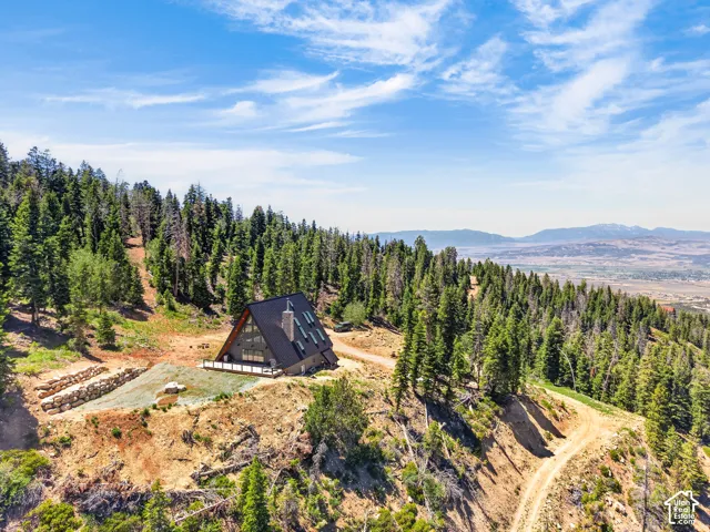 A-frame residence situated on a natural, sloped lot