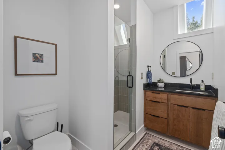 Bathroom with vanity and a stall shower