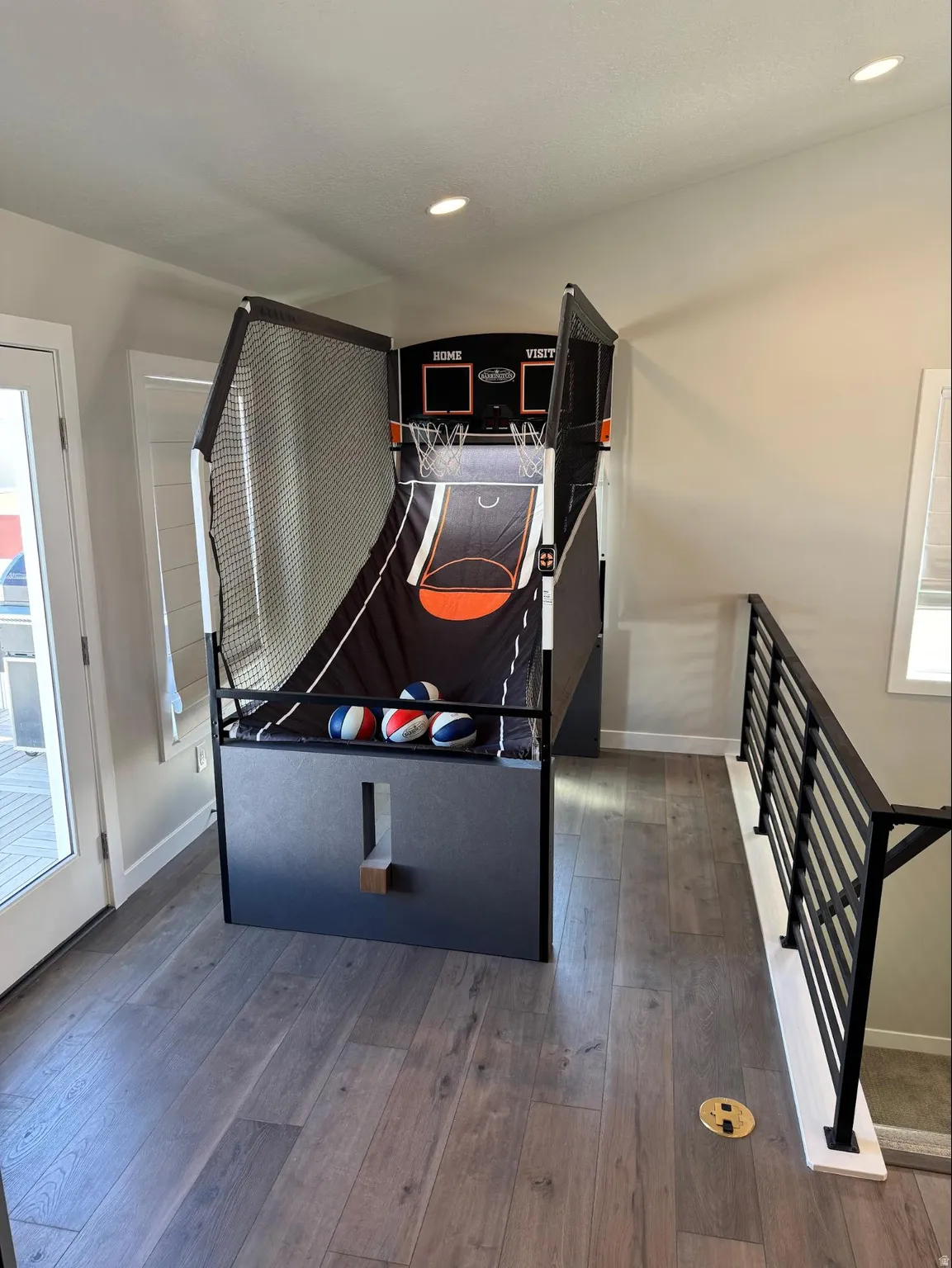 Playroom featuring dark wood-style floors and recessed lighting