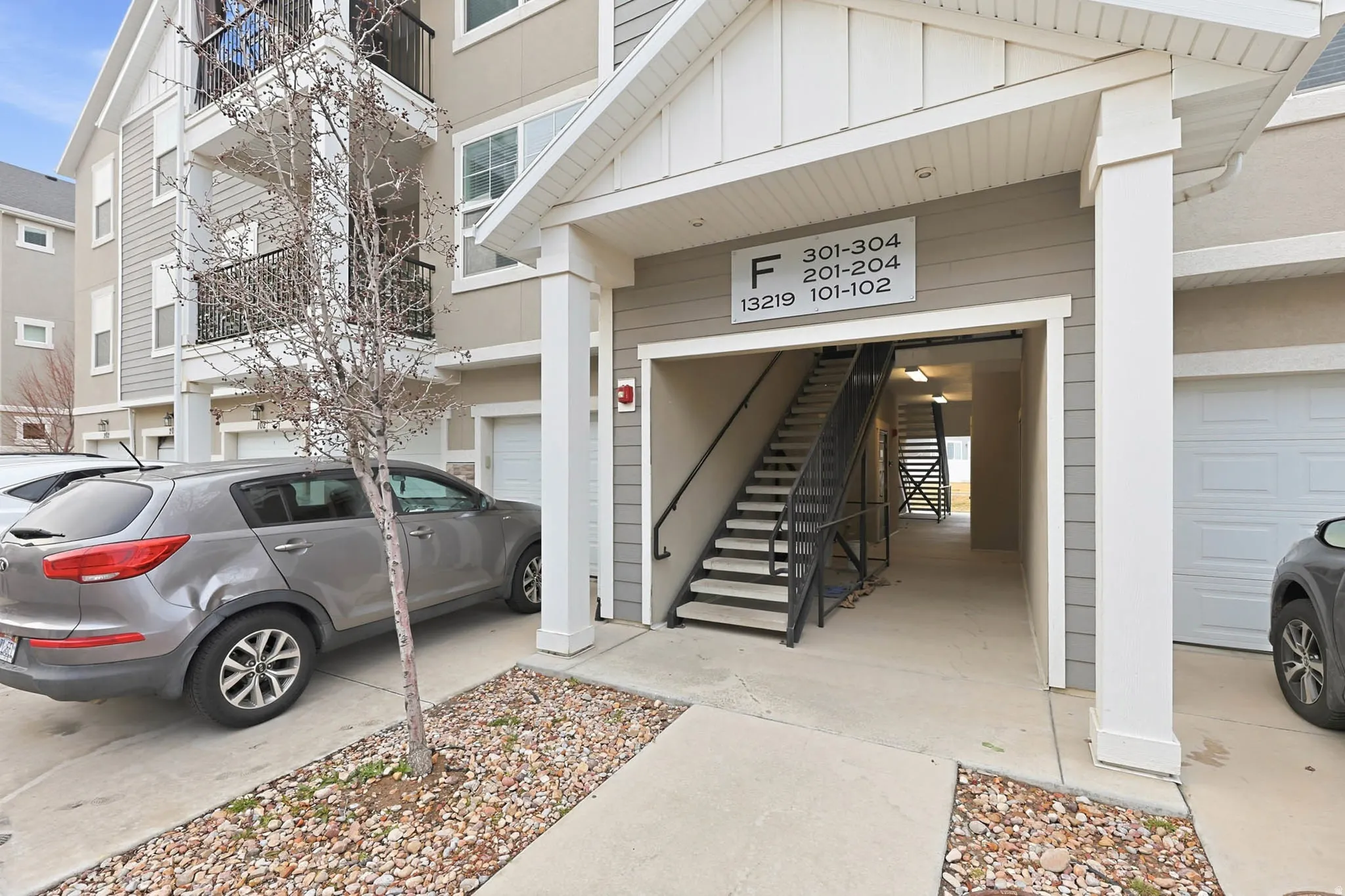 Doorway to property featuring board and batten siding and an attached garage