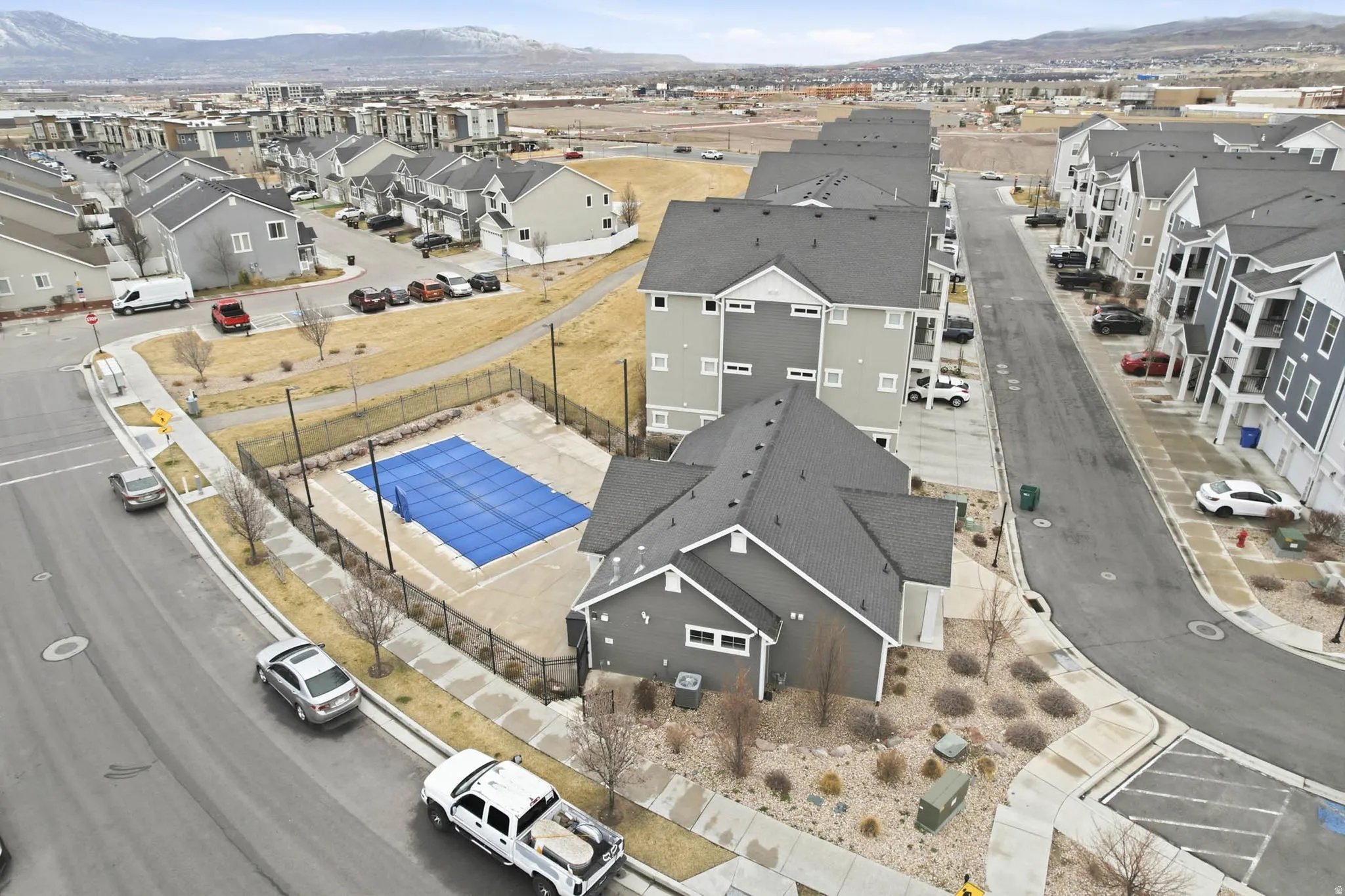 Aerial view of residential area featuring a mountainous background