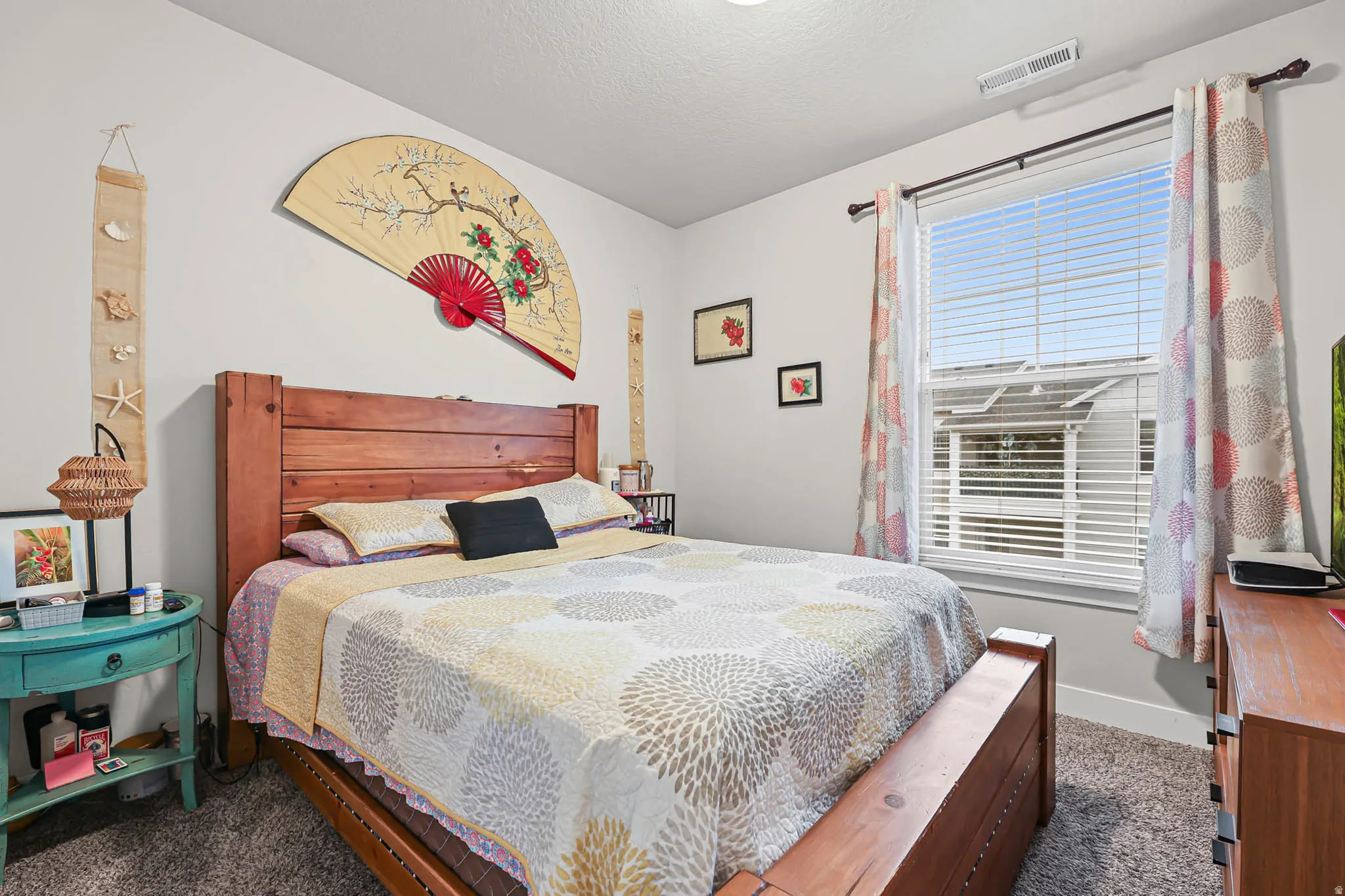 Bedroom with dark colored carpet