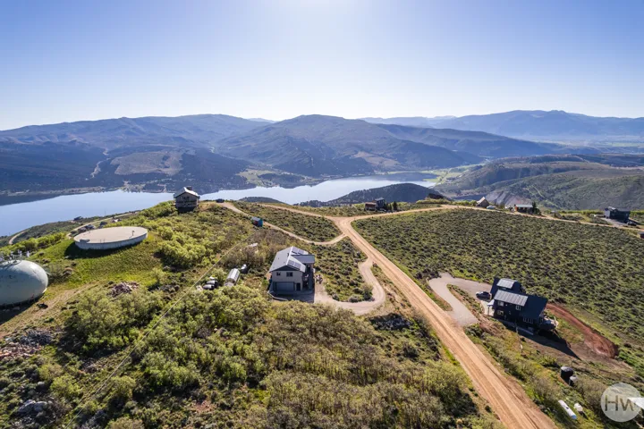 Elevated property with panoramic mountain and lake scenery