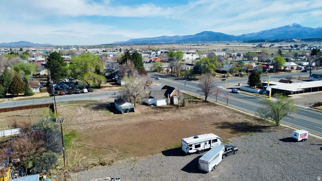 Aerial perspective of suburban area featuring a mountainous background