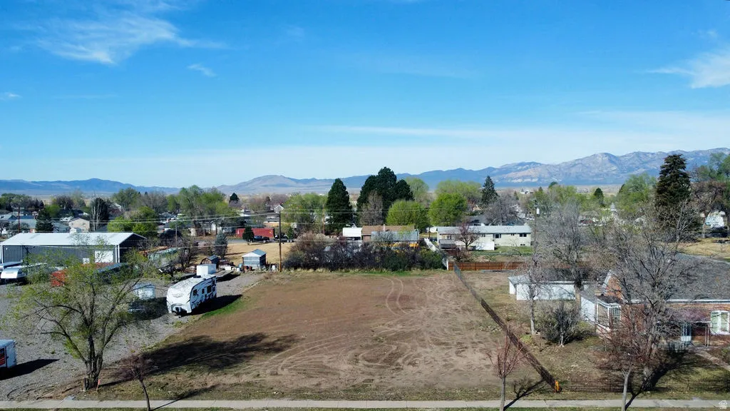 View of mountain backdrop featuring nearby suburban area