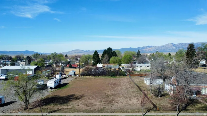 View of mountain backdrop featuring nearby suburban area