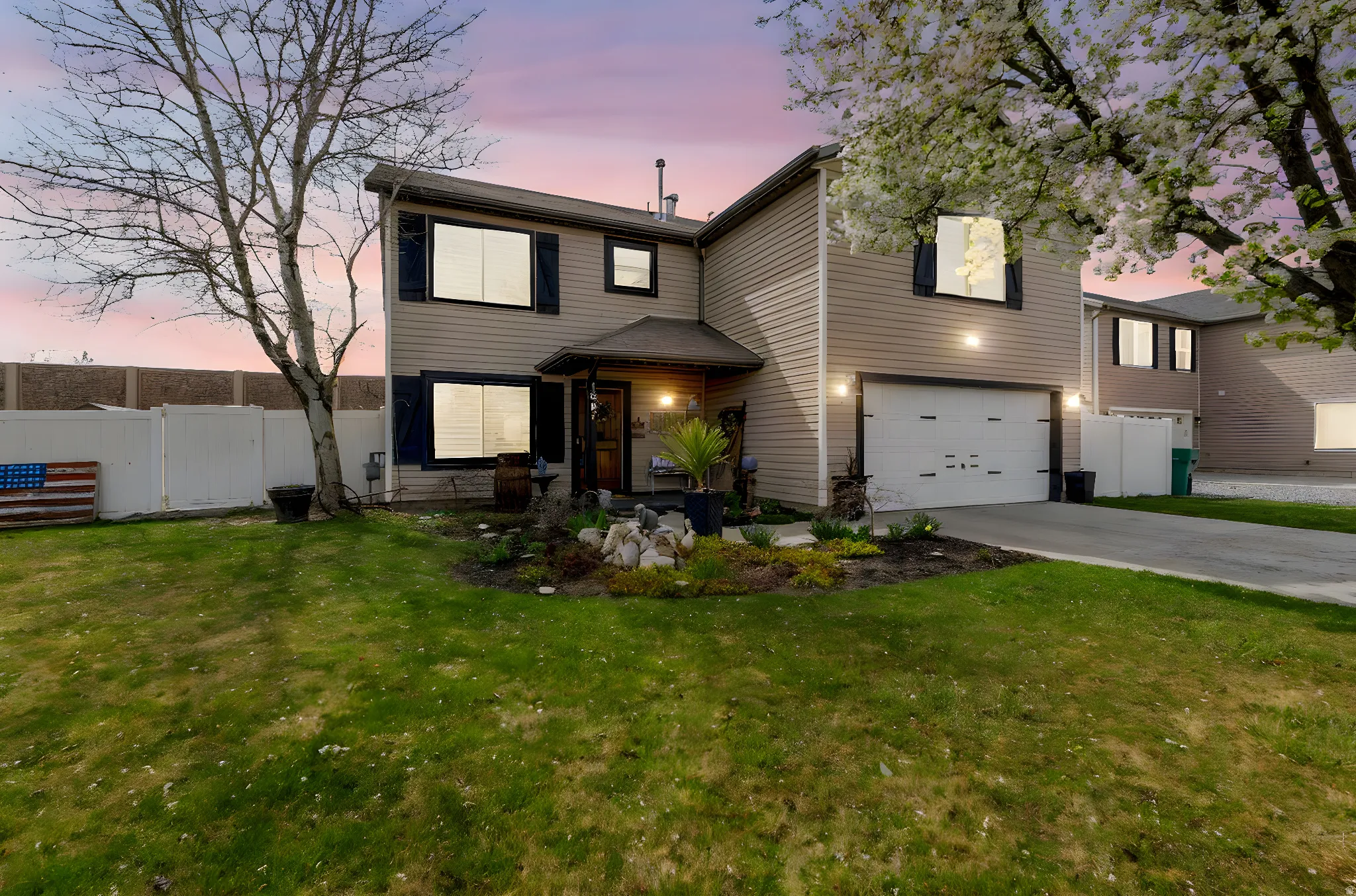 Traditional-style house with an attached garage and driveway