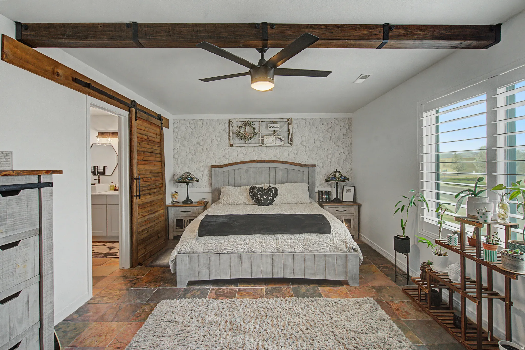 Oversized Primary Suite w/ beautiful wood beams & barn door