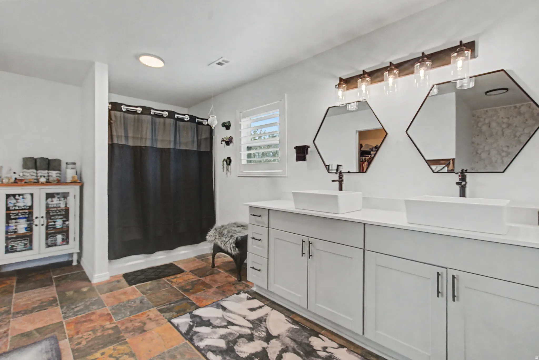 You could throw a party in here! All new vanity, sinks, faucetts, lighting