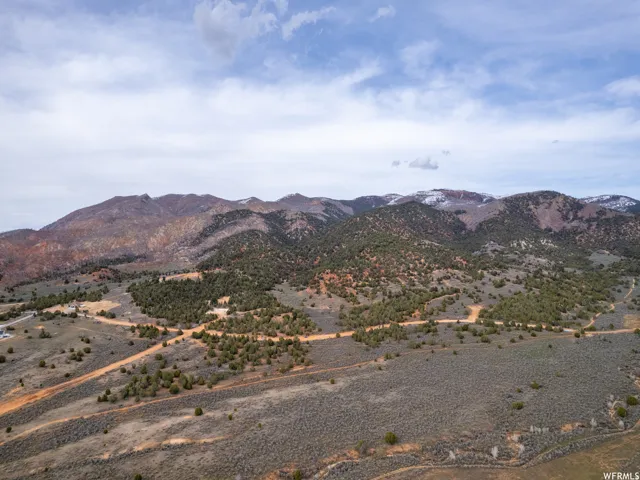 View of mountain backdrop featuring rural landscape