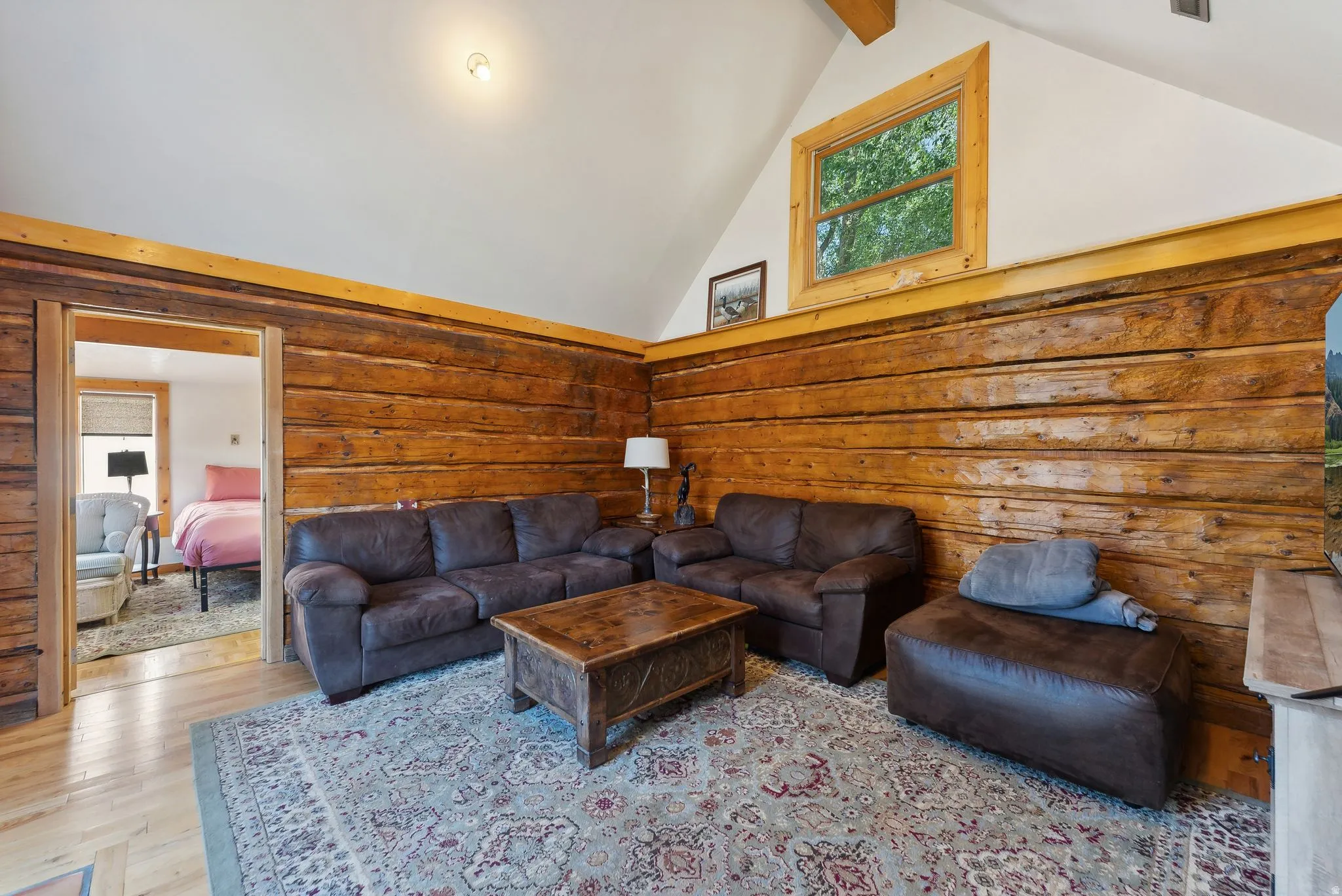 Living area featuring wood finished floors and healthy amount of natural light
