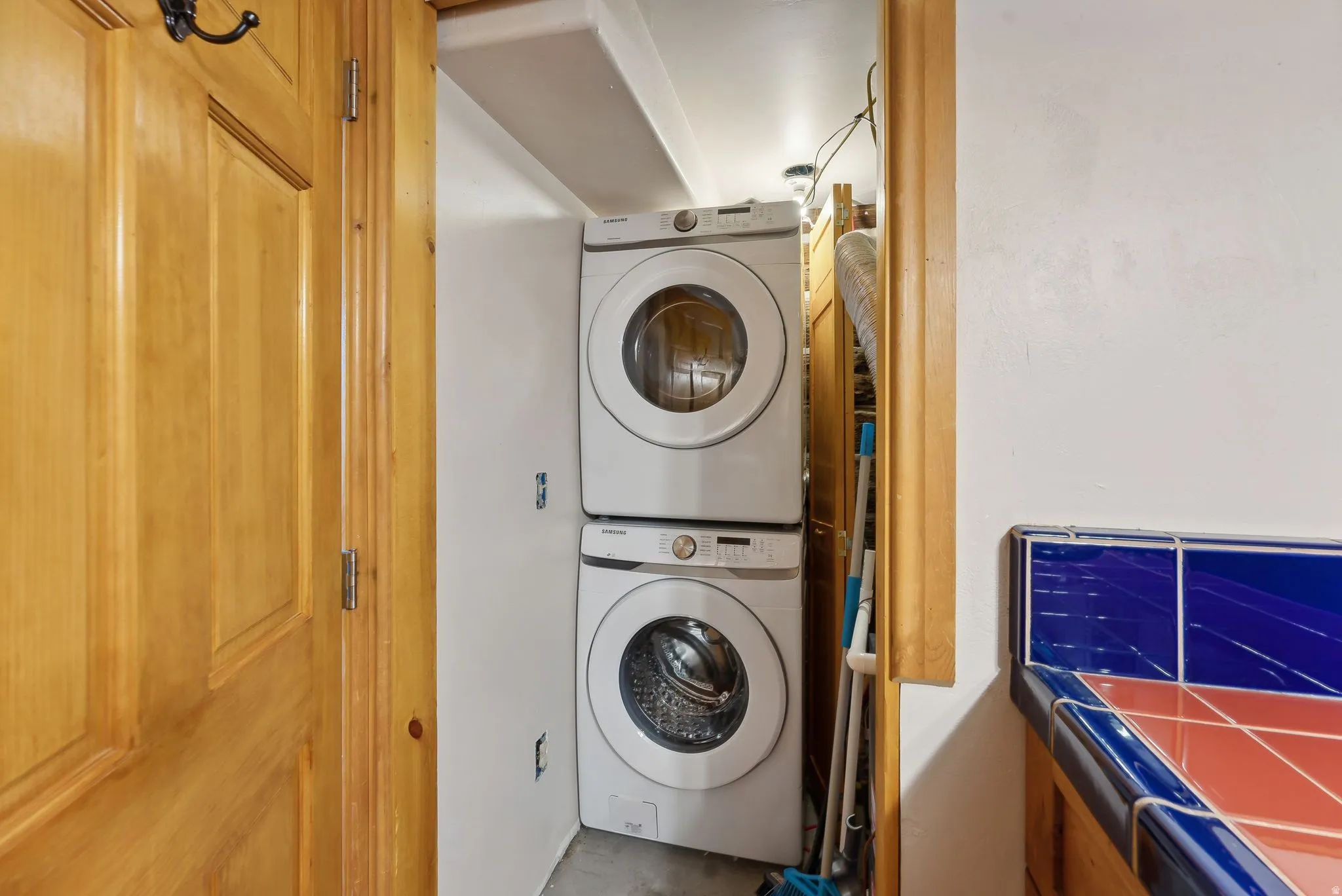 Laundry area with stacked washer / dryer