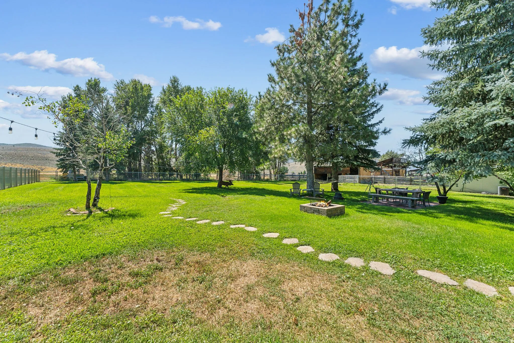 View of yard with a fire pit