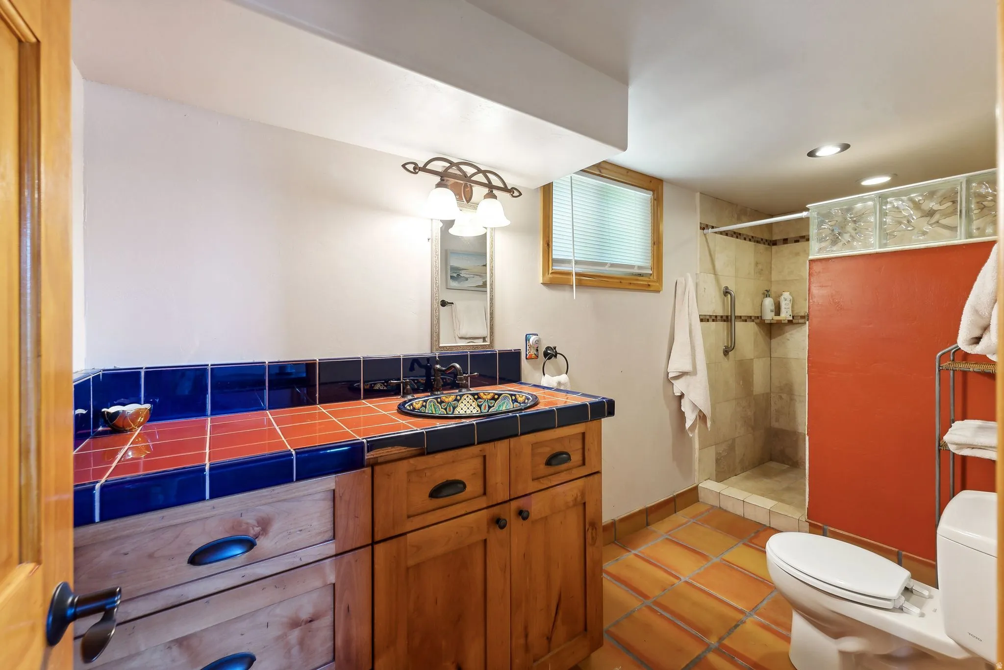 Full bath with vanity, a stall shower, light tile patterned floors, and recessed lighting