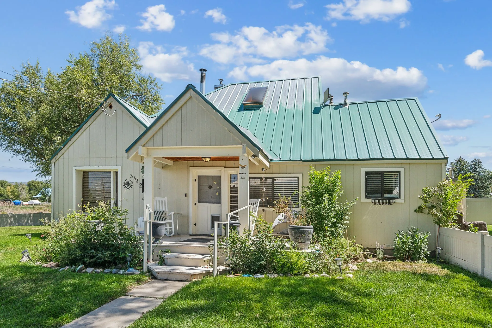 View of front of home featuring a metal roof