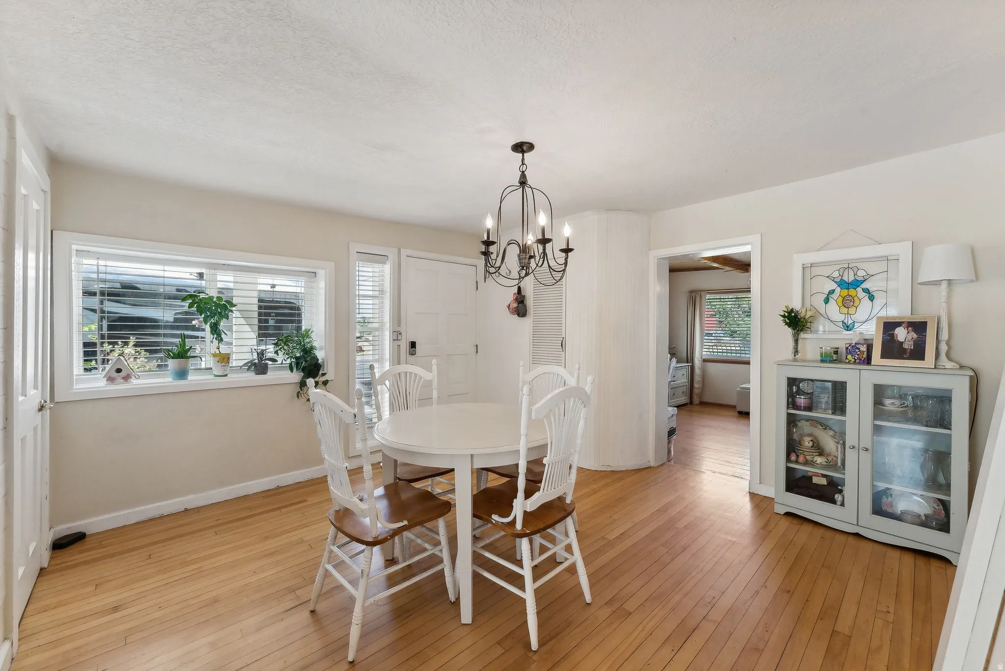 Dining room featuring light wood-type flooring and hanging lights