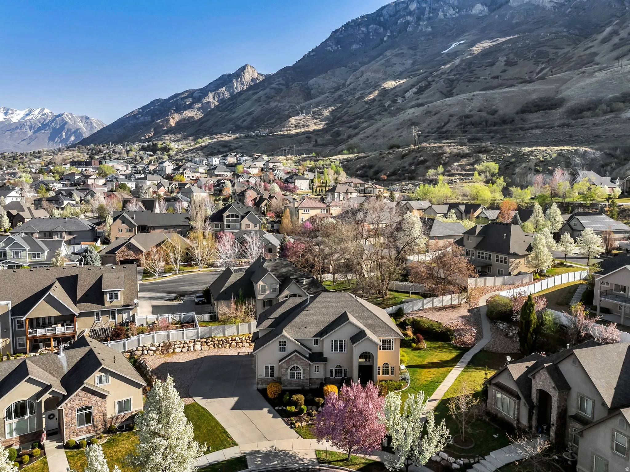 Aerial view of residential area featuring mountains