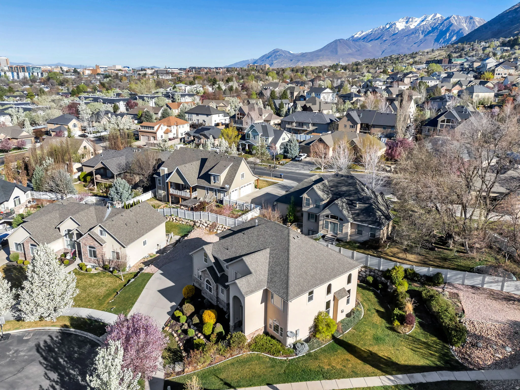 Aerial perspective of suburban area with a mountainous background