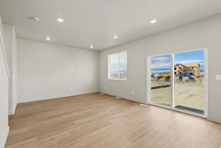 Spare room with light wood-style flooring and recessed lighting
