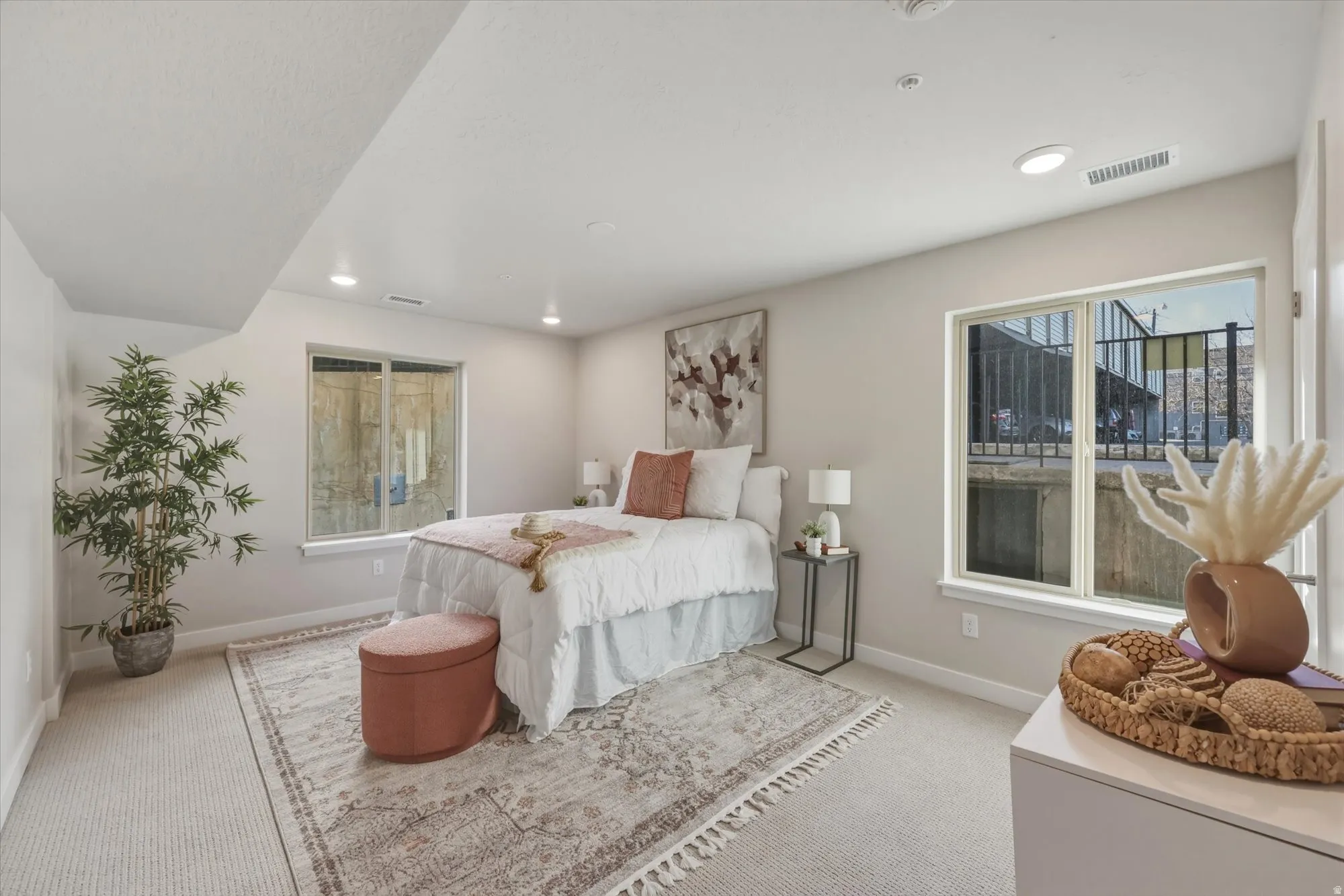 Bedroom featuring light carpet and recessed lighting