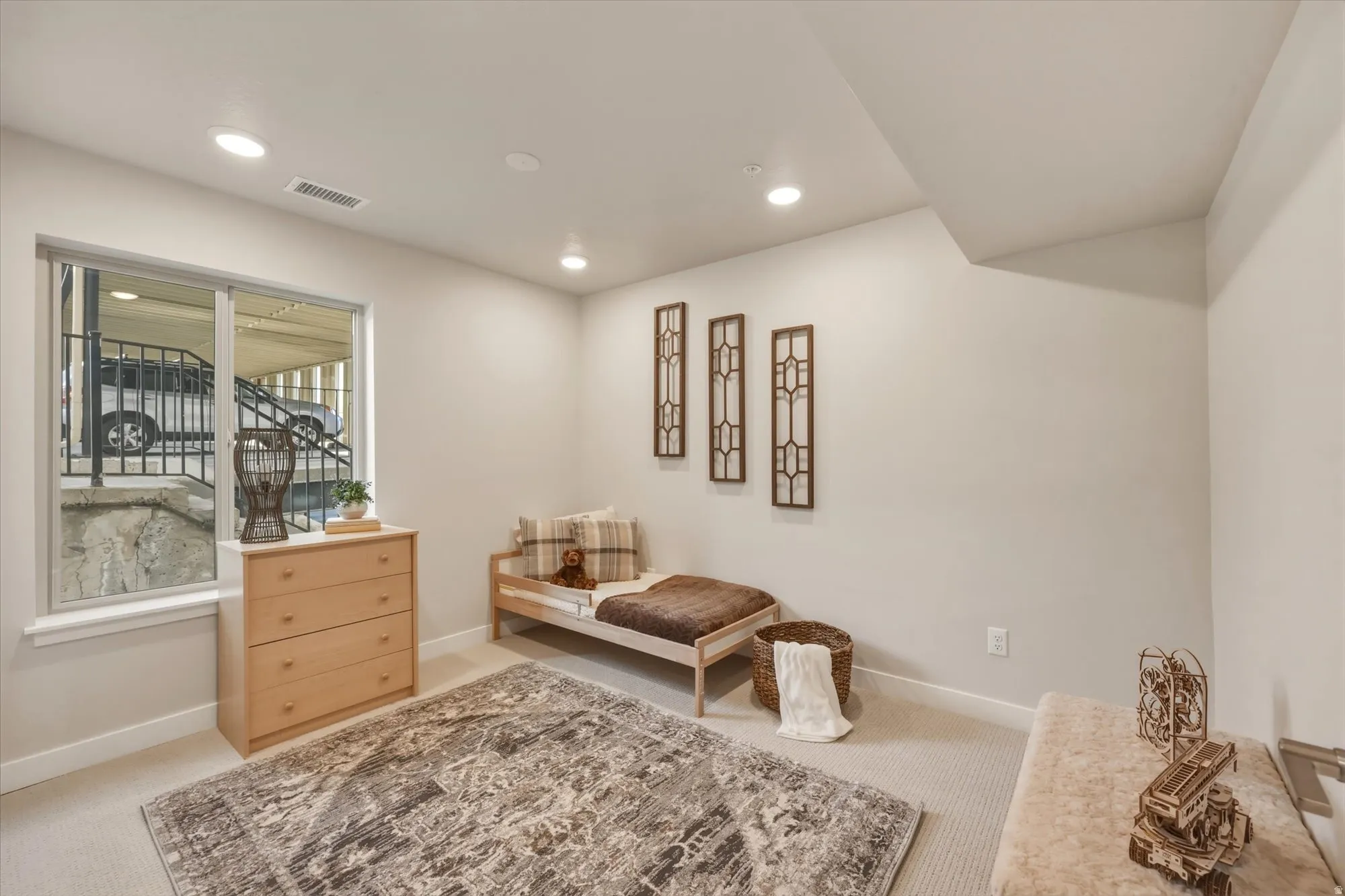 Sitting room featuring light colored carpet and recessed lighting