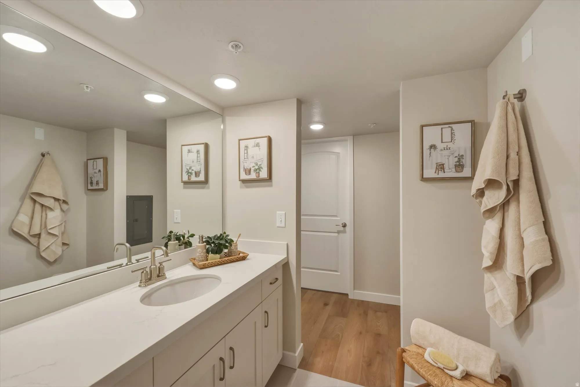 Bathroom featuring vanity, recessed lighting, and light wood finished floors