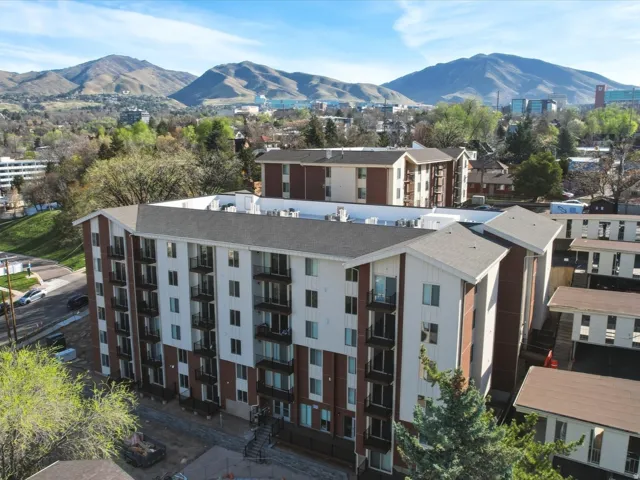 Bird's eye view of a mountainous background and apartment complex