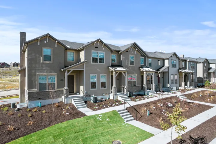 View of front facade featuring a residential view and stucco siding