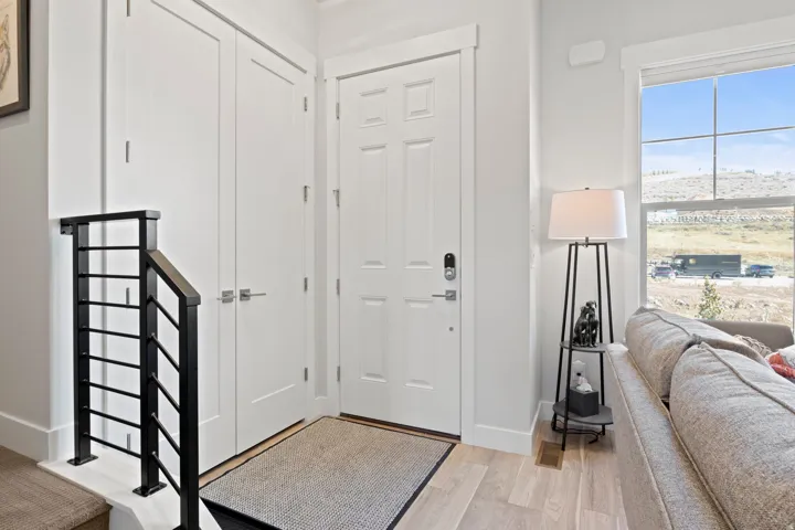 Entrance foyer with light wood-style flooring and baseboards