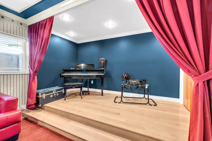 Living area with wood finished floors, ornamental molding, and recessed lighting