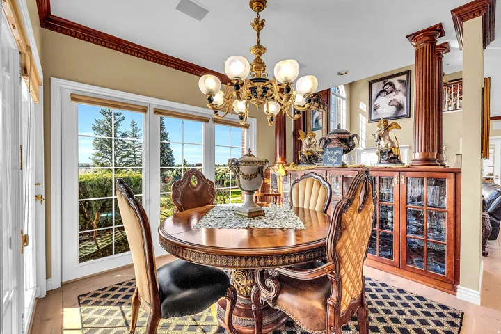 Dining room with hanging lights and baseboards