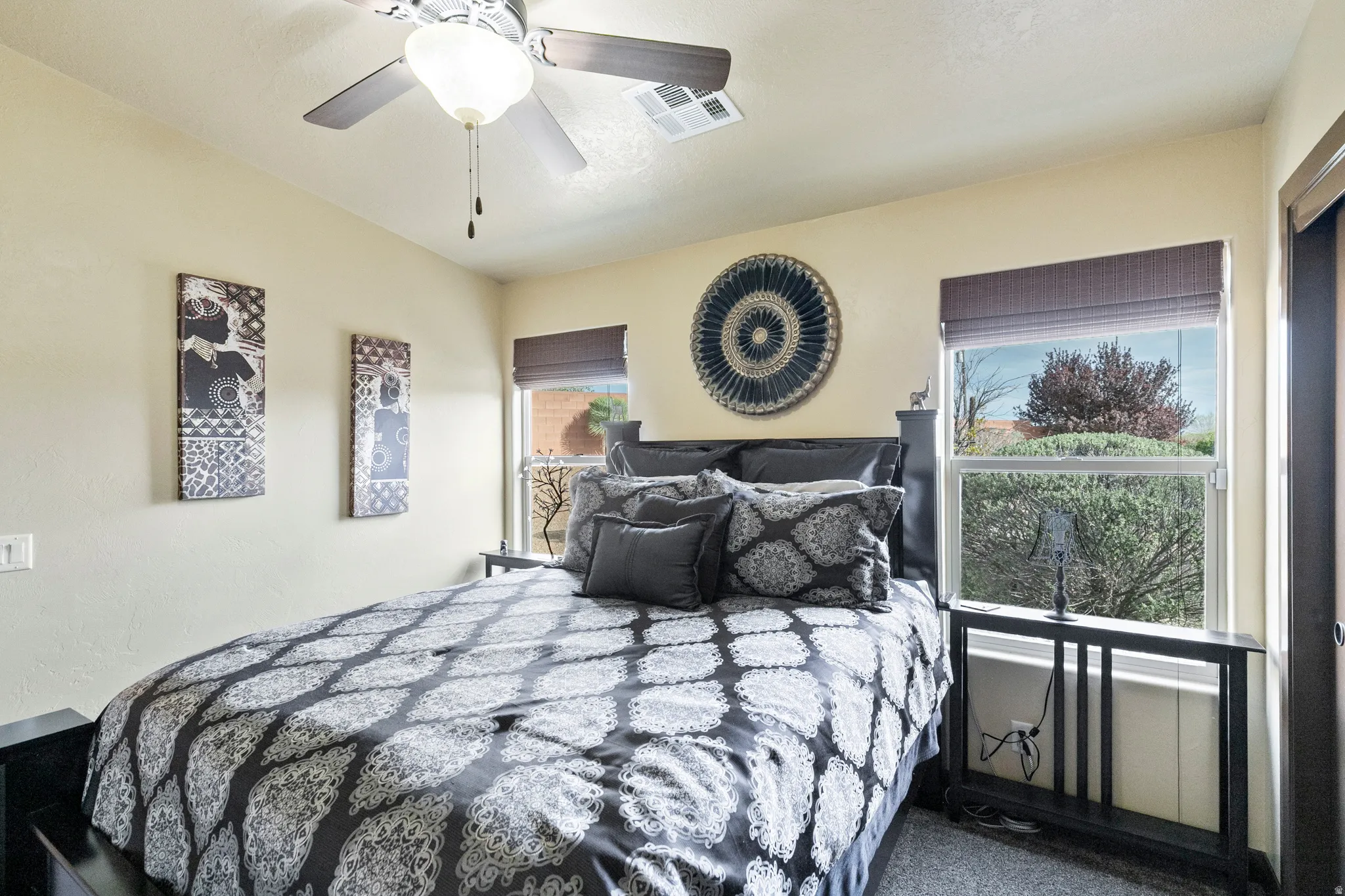 Bedroom with ceiling fan and carpet flooring