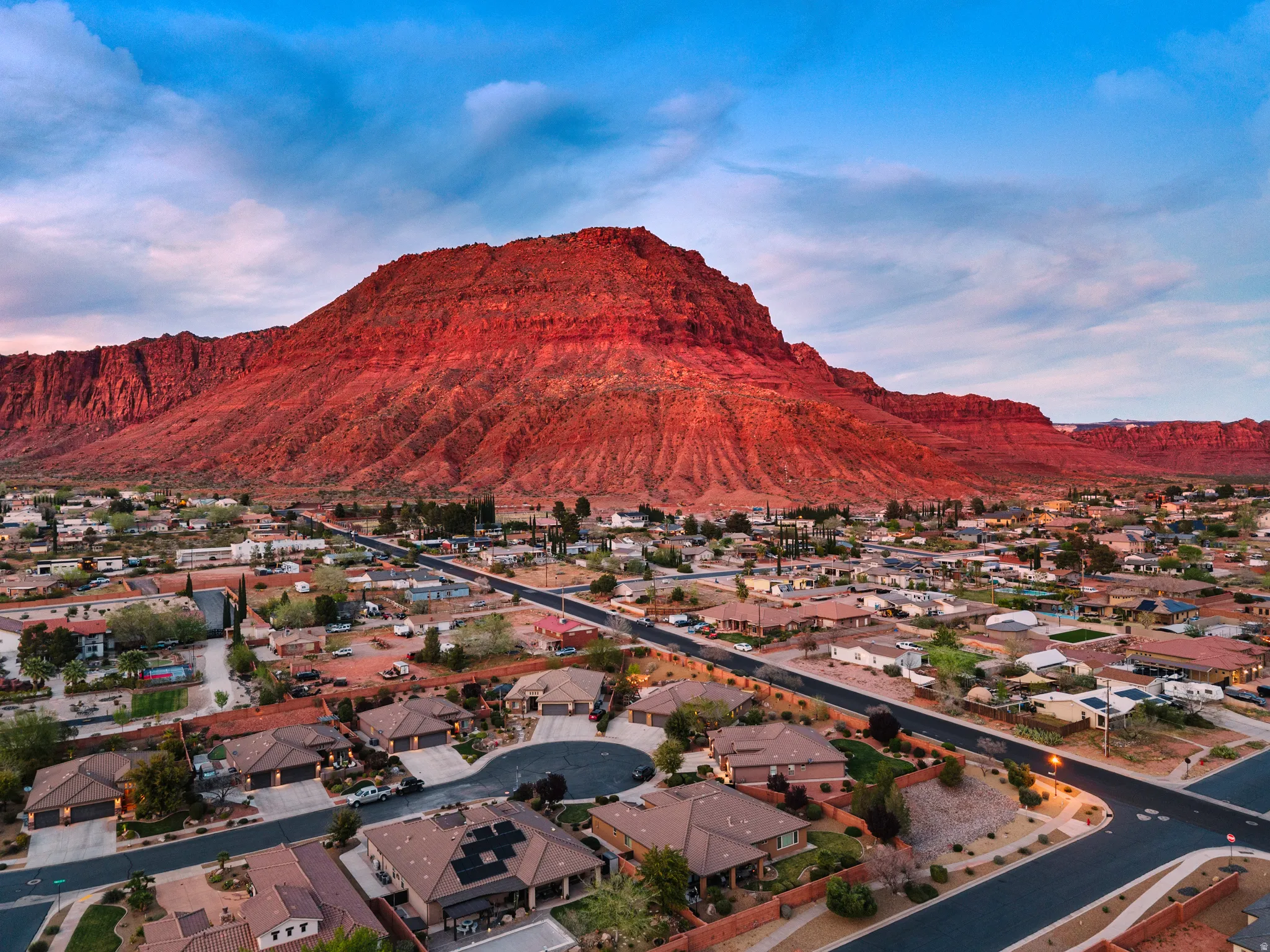 Aerial view of residential area featuring a mountain backdrop