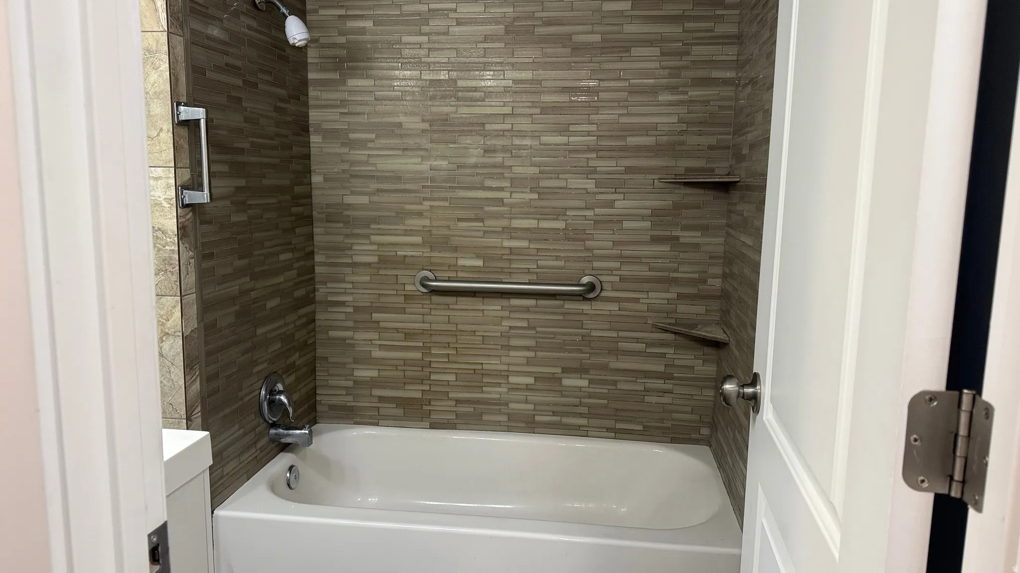 Bathroom with shower / bath combination and vanity