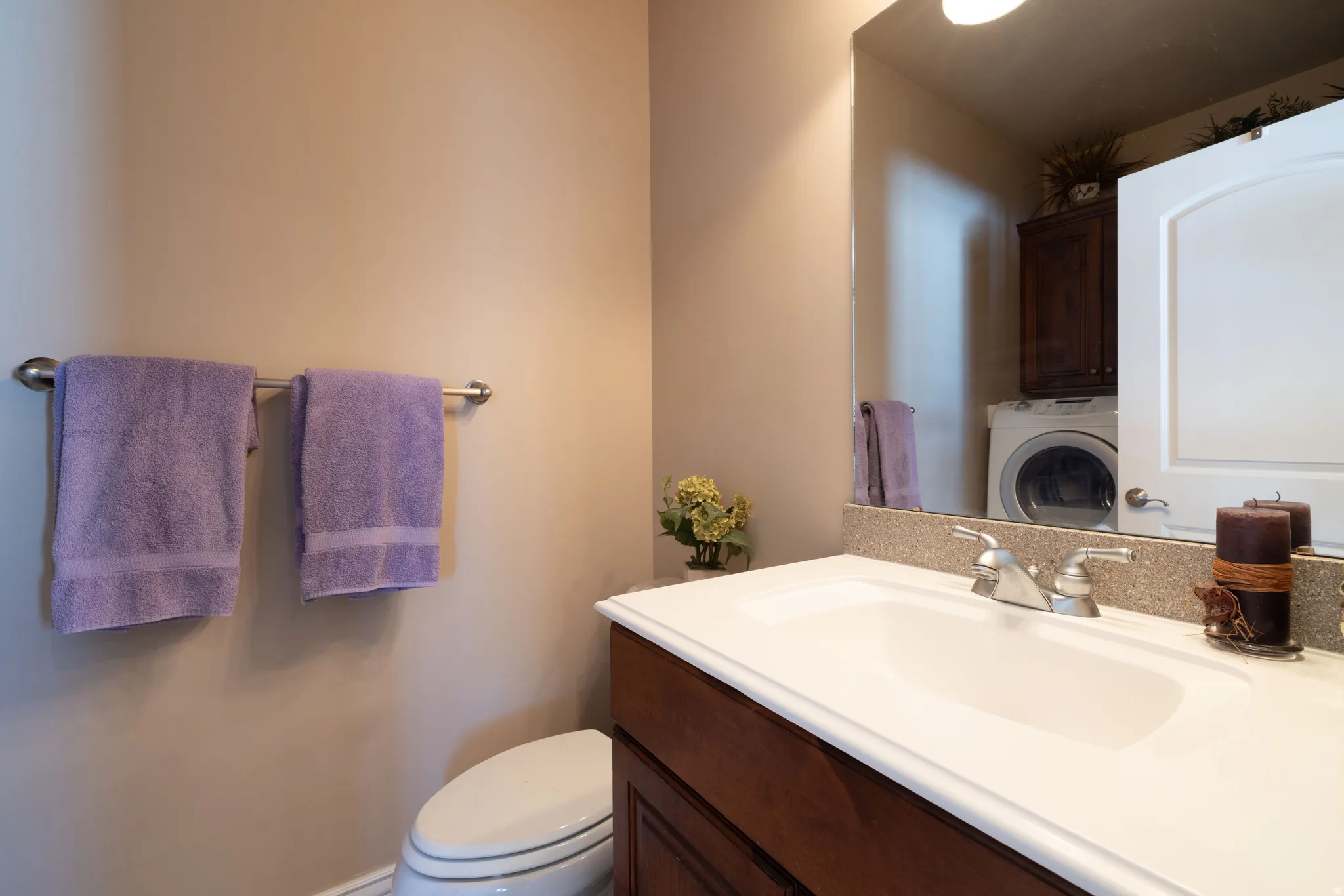 Half bath with washer / dryer and vanity