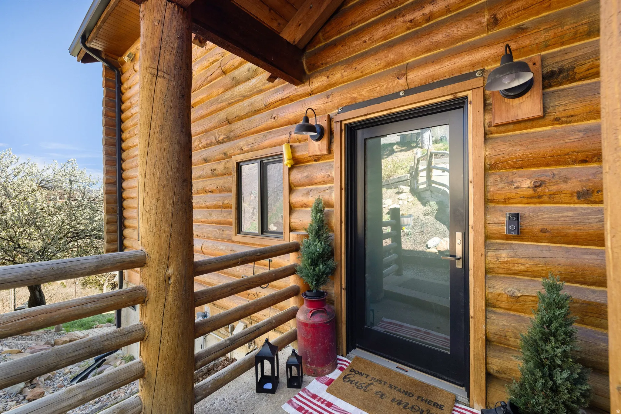 Property entrance with log siding